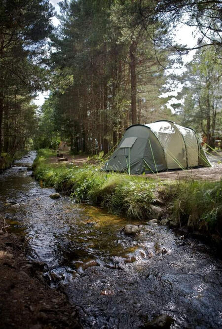 Camping near the creek with outdoor tech lab