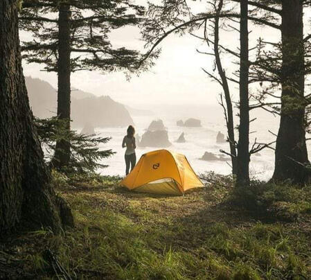 Camping by the lake using the best outdoor gear deals for beginners with Outdoor Tech Lab.
